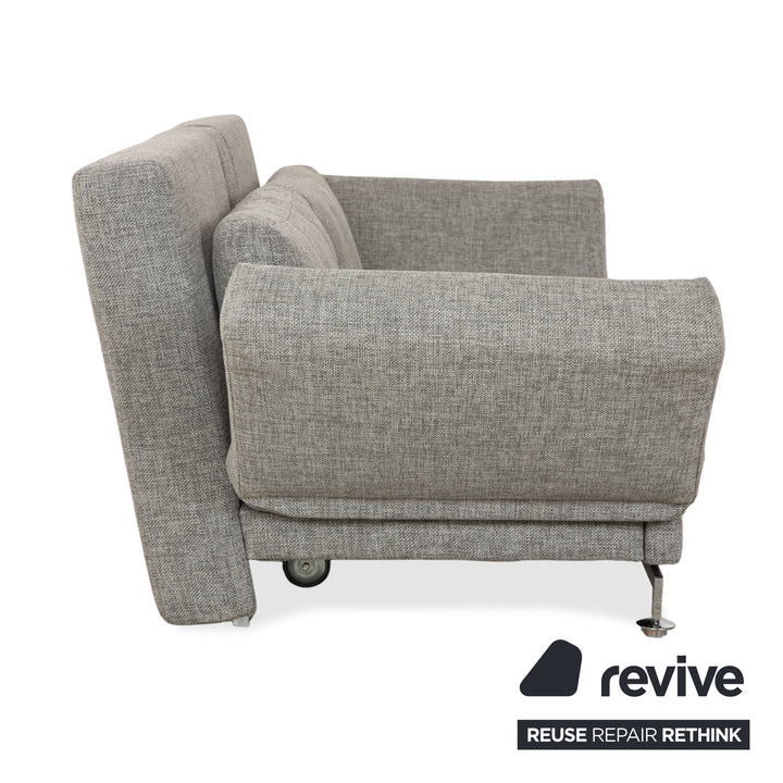 Canapé deux places en tissu gris Brühl Moule, avec fonction couchage.