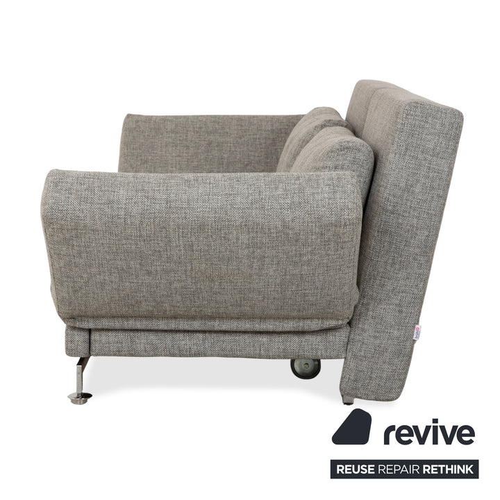 Canapé deux places en tissu gris Brühl Moule, avec fonction couchage.