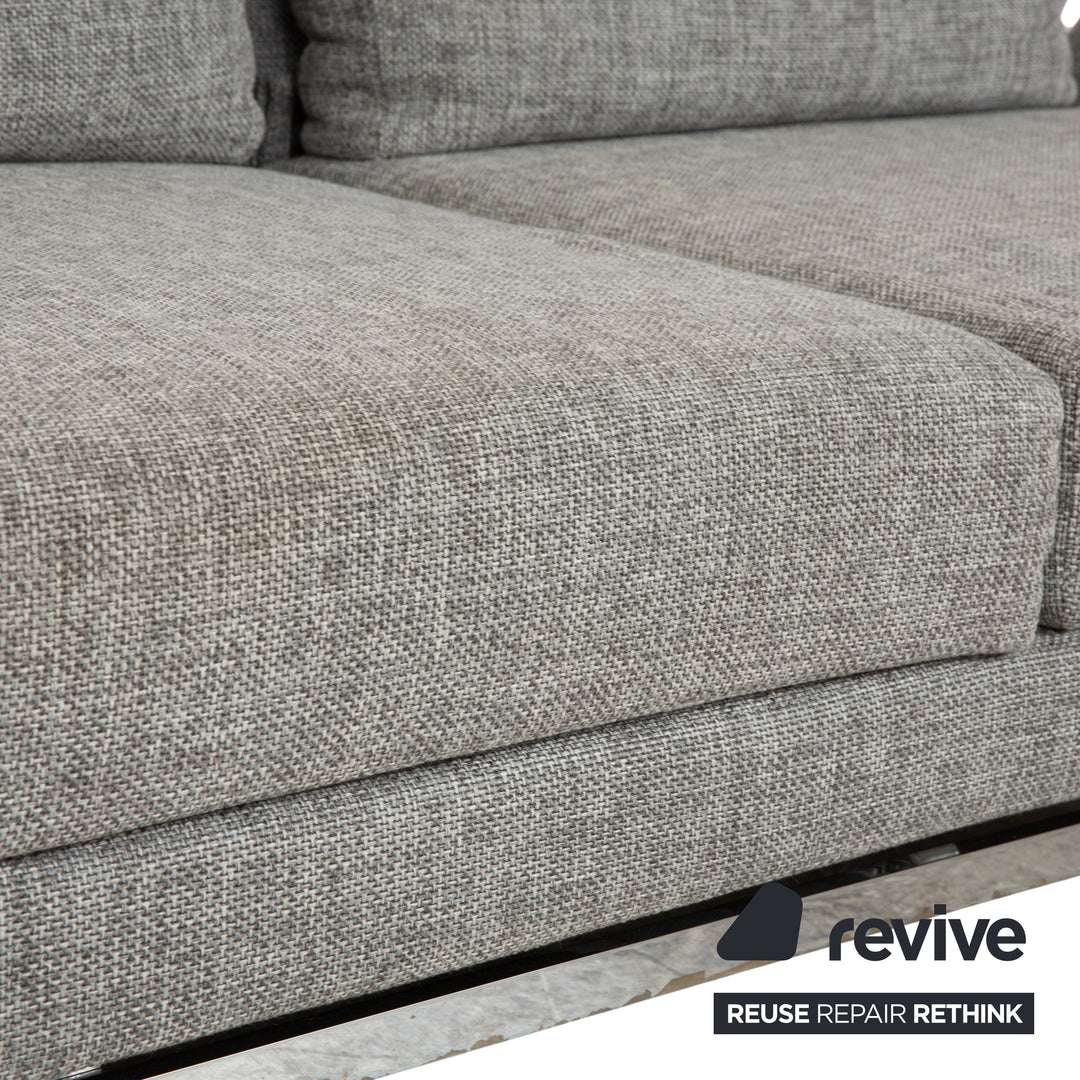 Canapé deux places en tissu gris Brühl Moule, avec fonction couchage.