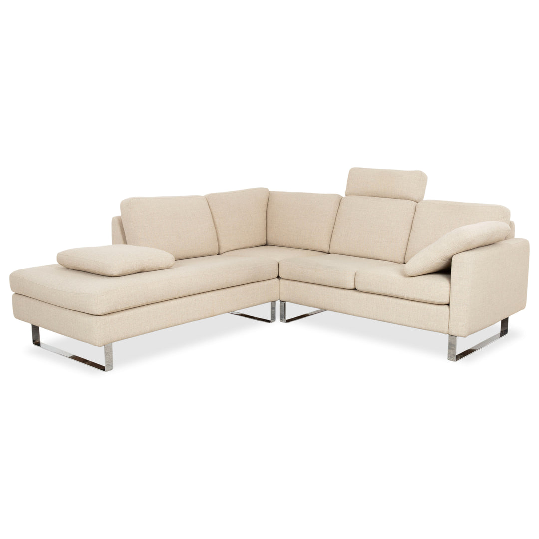 Cor Conseta Corner Sofa Fabric Beige Cream Sand Couch with Chrome Skids Left Chaise Footrest