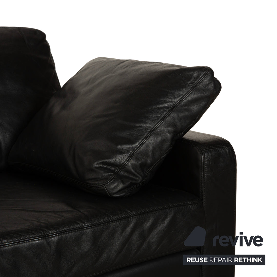 Canapé deux places en cuir noir Cor Conseta