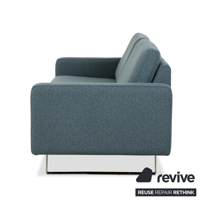 Réfection du canapé trois places COR Conseta en tissu bleu, vert, turquoise et gris