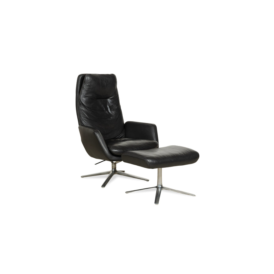 Fauteuil en cuir Cor Cordia noir à fonction manuelle avec tabouret