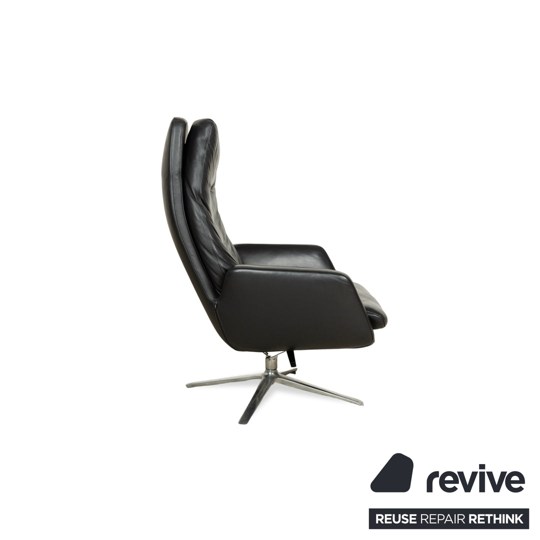 Fauteuil en cuir Cor Cordia noir à fonction manuelle avec tabouret