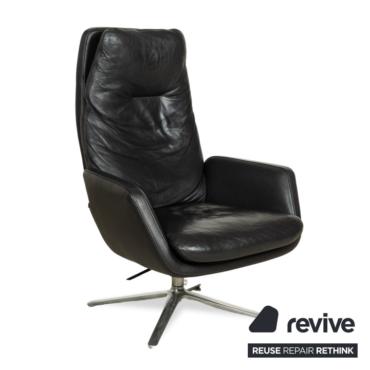 Fauteuil en cuir Cor Cordia noir à fonction manuelle avec tabouret