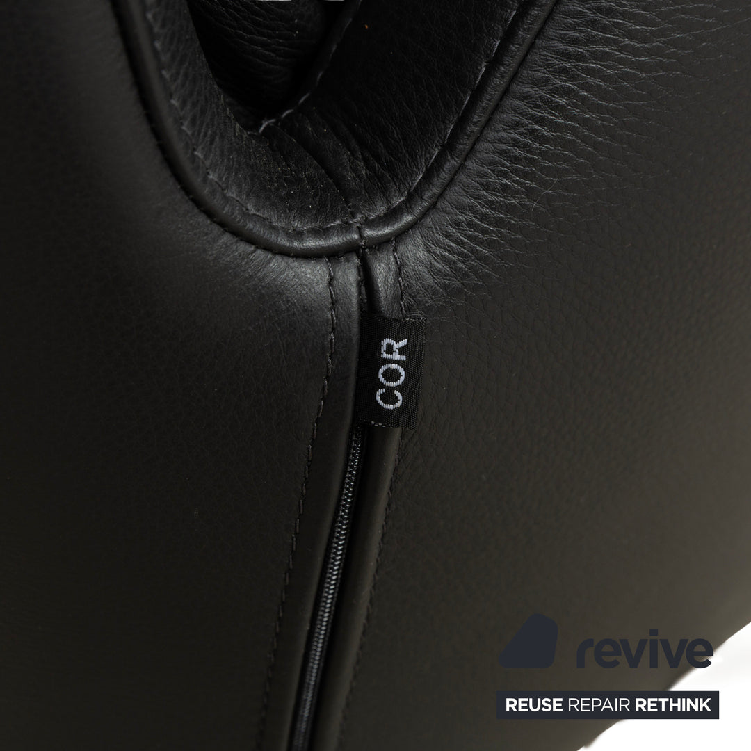 Fauteuil en cuir Cor Cordia noir à fonction manuelle avec tabouret