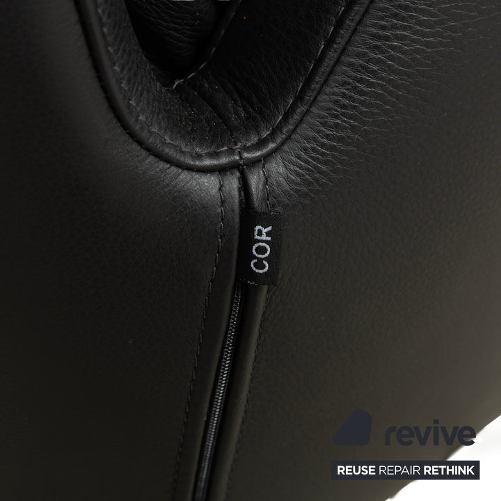 Fauteuil en cuir Cor Cordia noir à fonction manuelle avec tabouret