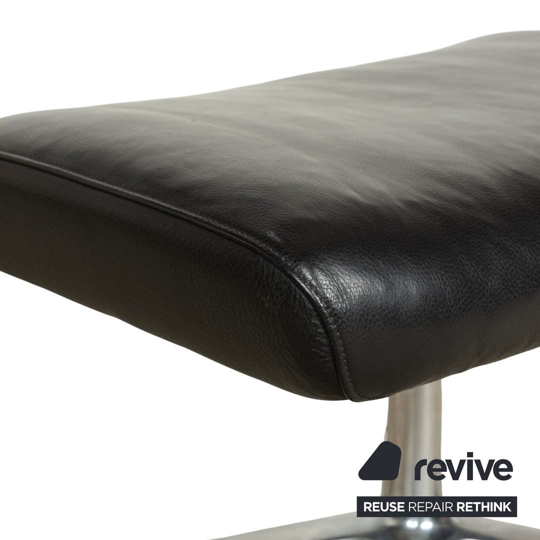 Fauteuil en cuir Cor Cordia noir à fonction manuelle avec tabouret
