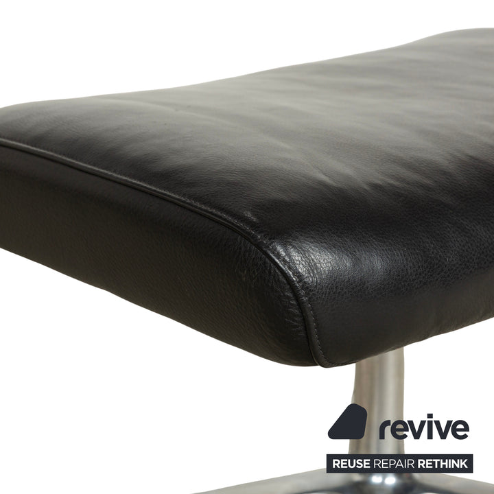 Fauteuil en cuir Cor Cordia noir à fonction manuelle avec tabouret