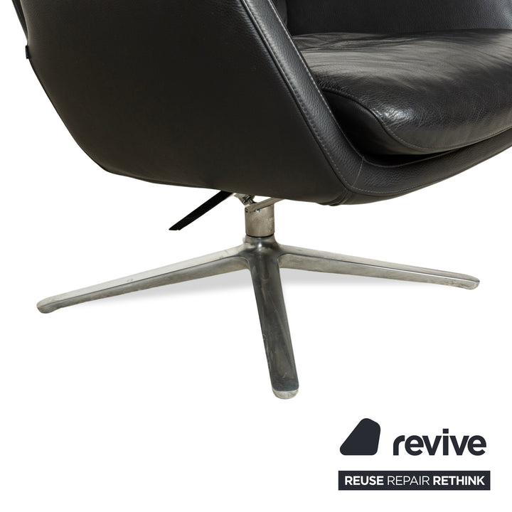 Fauteuil en cuir Cor Cordia noir à fonction manuelle avec tabouret