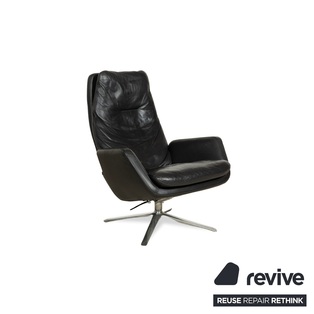 Fauteuil en cuir Cor Cordia noir à fonction manuelle avec tabouret