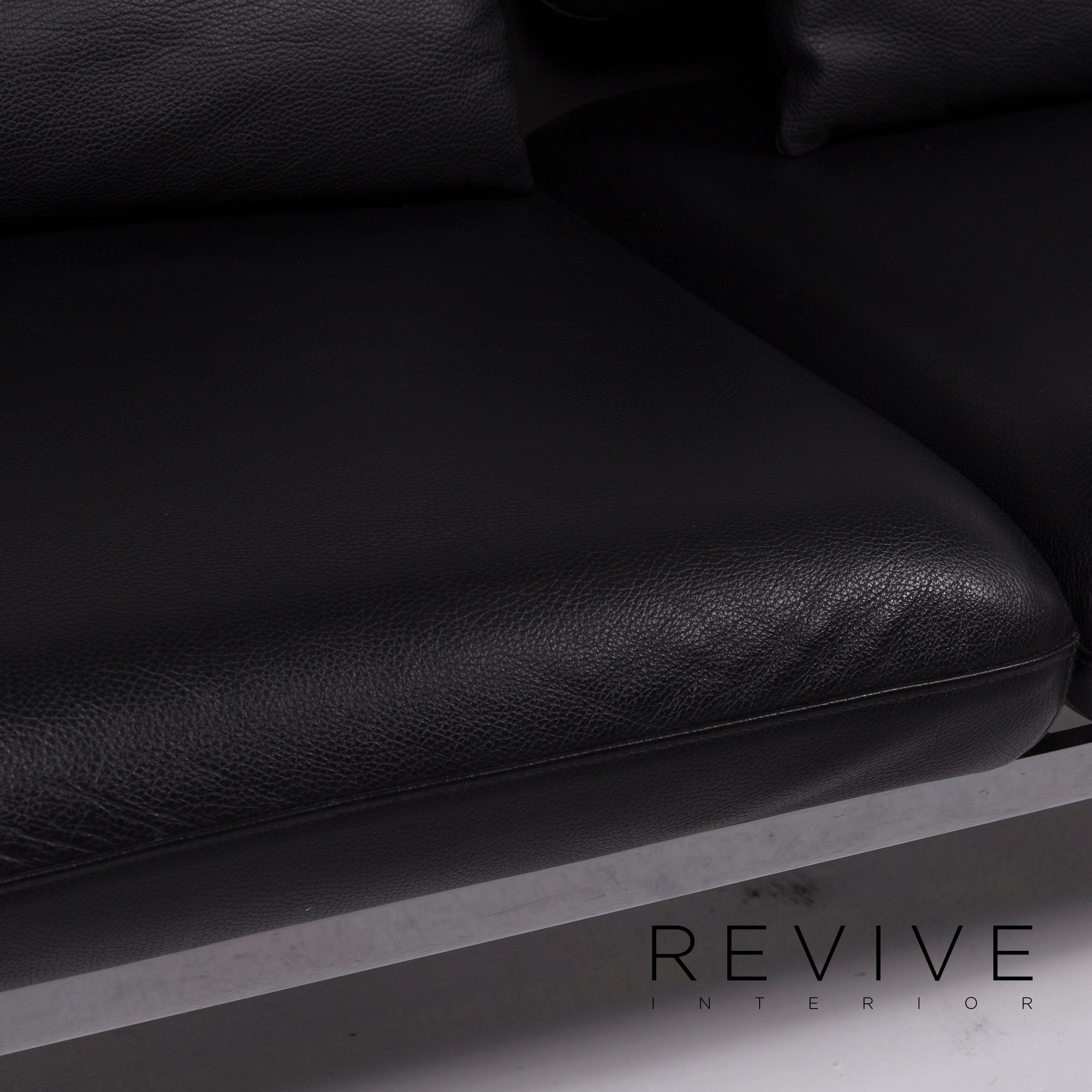 Canapé deux places Brühl Roro Medium en cuir noir avec fonction manuelle