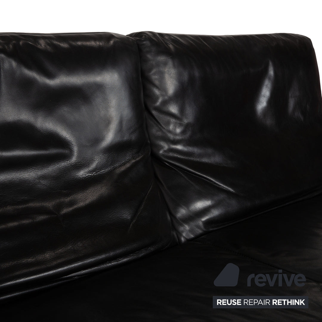 Canapé quatre places Koinor Raoul en cuir gris foncé anthracite et noir, à réglage manuel