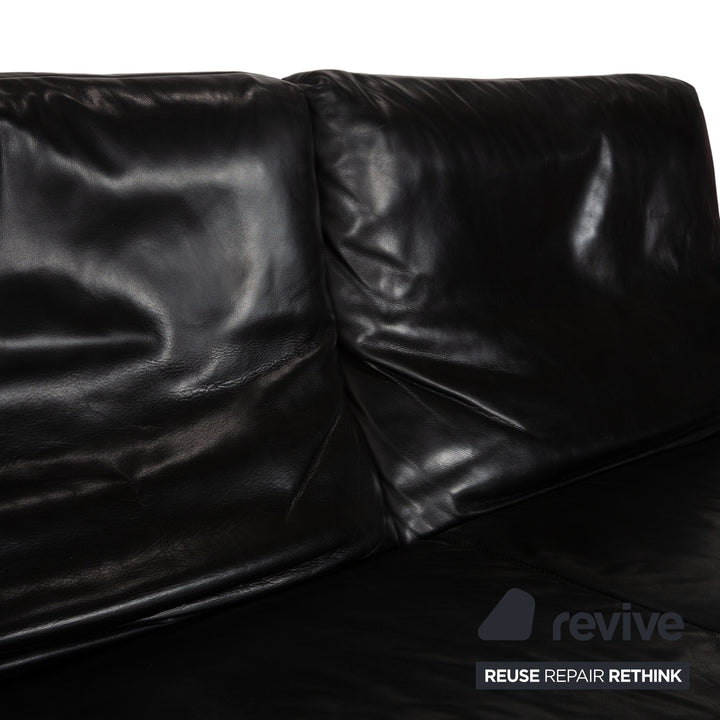 Canapé quatre places Koinor Raoul en cuir gris foncé anthracite et noir, à réglage manuel