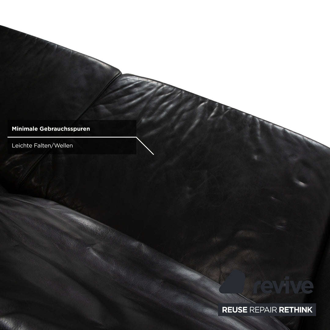 Canapé quatre places Koinor Raoul en cuir gris foncé anthracite et noir, à réglage manuel