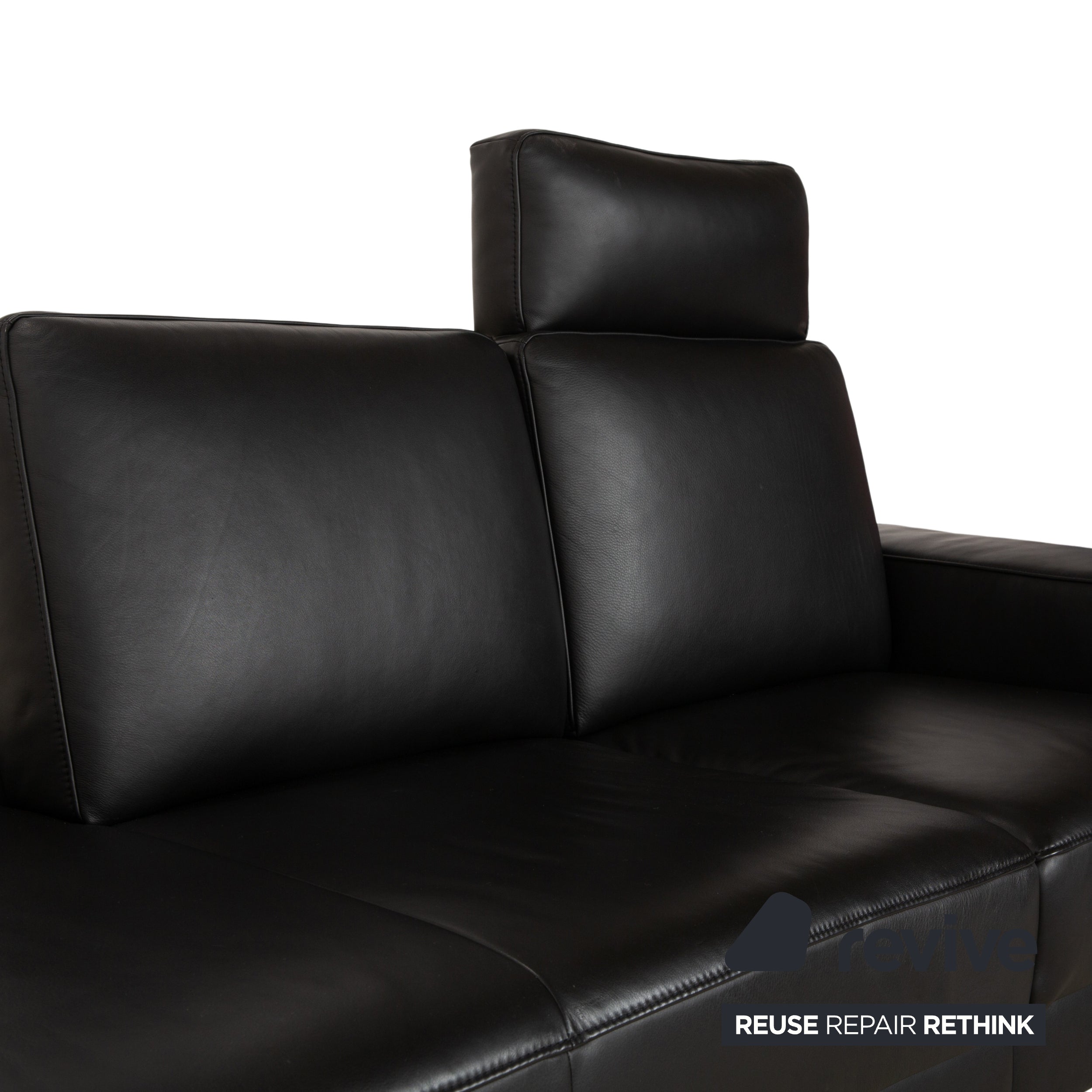 Canapé deux places en cuir noir Koinor Upgrade avec appui-tête