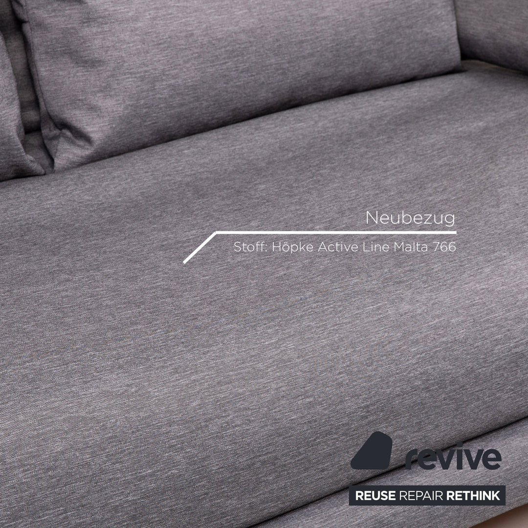 Canapé-lit en tissu Ligne Roset Multy, gris, avec fonction couchage.
