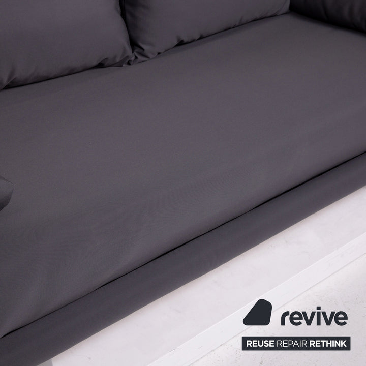 ligne roset Multy canapé en tissu gris, trois places avec fonction relax et couchage, piètement gris