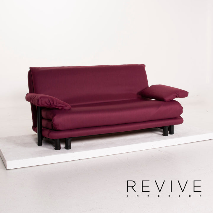 Canapé Ligne Roset Multy en tissu, violet, trois places, avec fonction convertible et accoudoirs inclus.