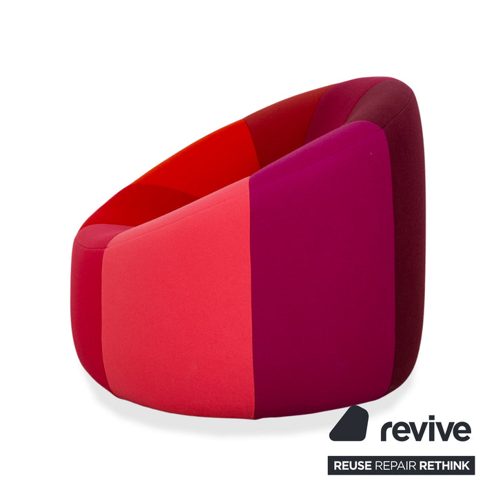 Ligne Roset Pumpkin fabric armchair in red, magenta, and pink