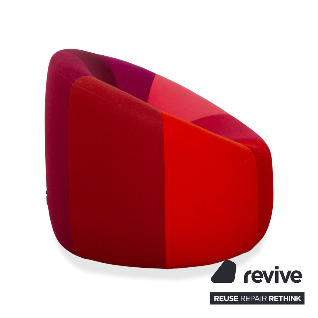 Ligne Roset Pumpkin fabric armchair in red, magenta, and pink