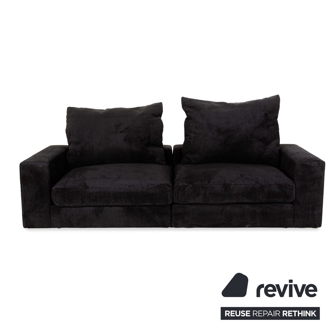 Canapé quatre places en tissu MYCS FLAYR avec tabouret noir