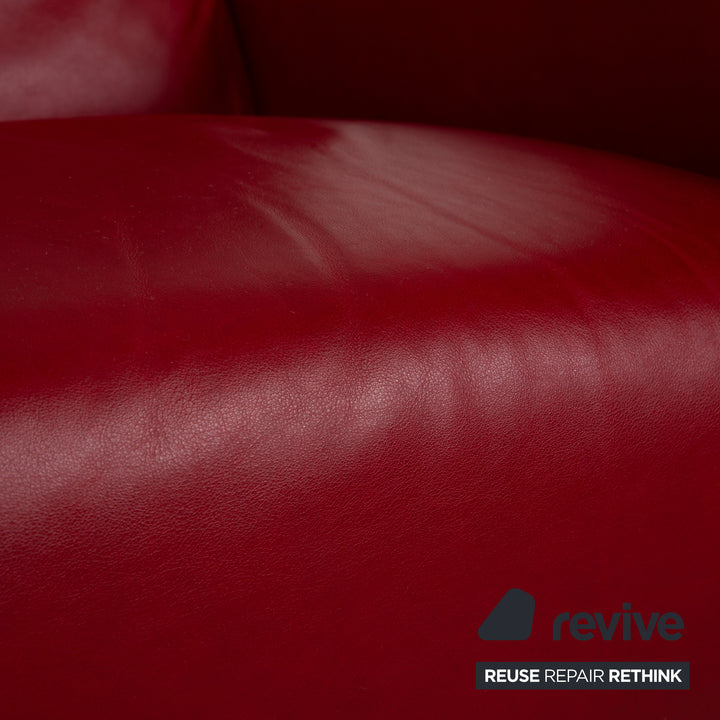 Fauteuil en cuir cristal Natuzzi rouge cerise