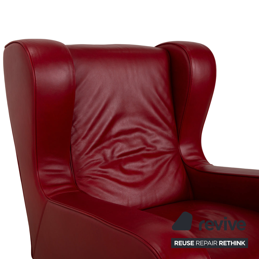 Fauteuil en cuir cristal Natuzzi rouge cerise