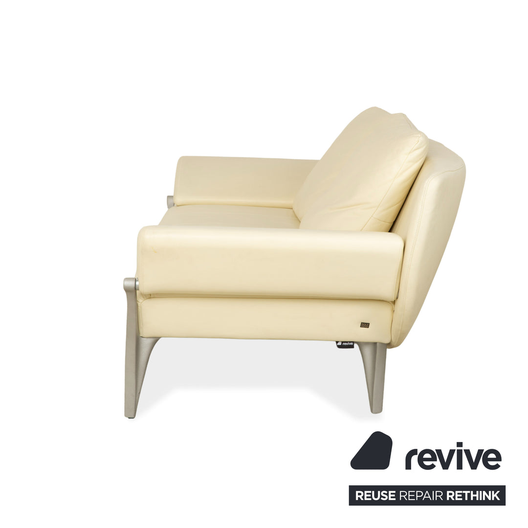 Canapé deux places en cuir Rolf Benz 1600 + tabouret blanc crème, fonction manuelle