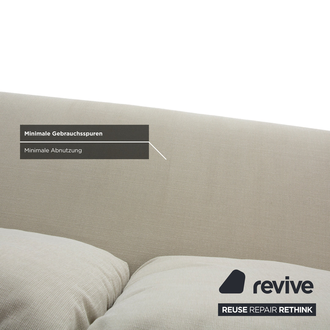 Canapé 2 places Rolf Benz 1600 en tissu crème menthe, à réglage manuel.