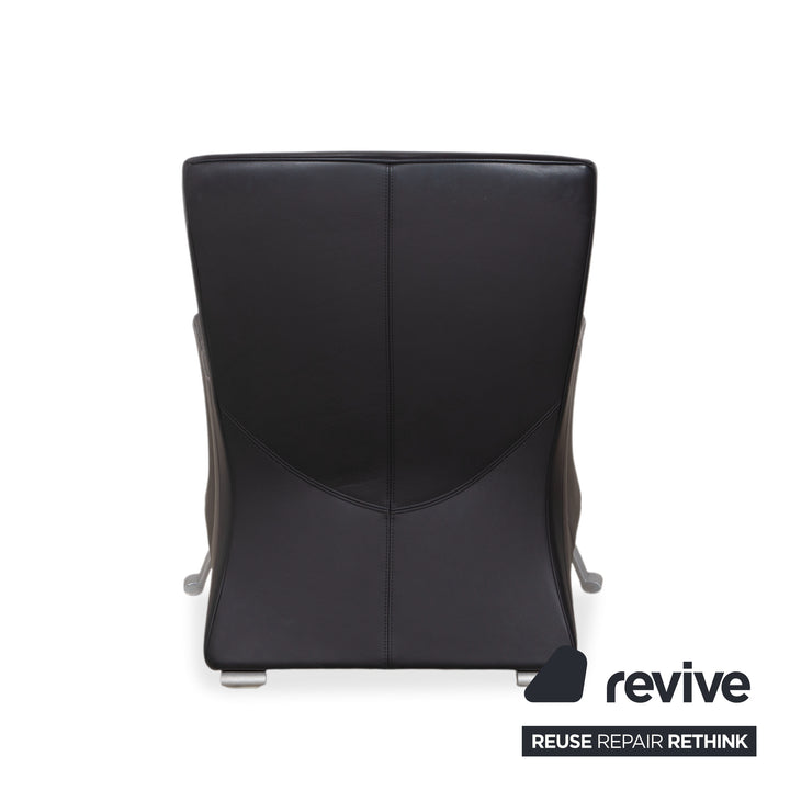 Fauteuil Rolf Benz 322 en cuir noir avec repose-pieds