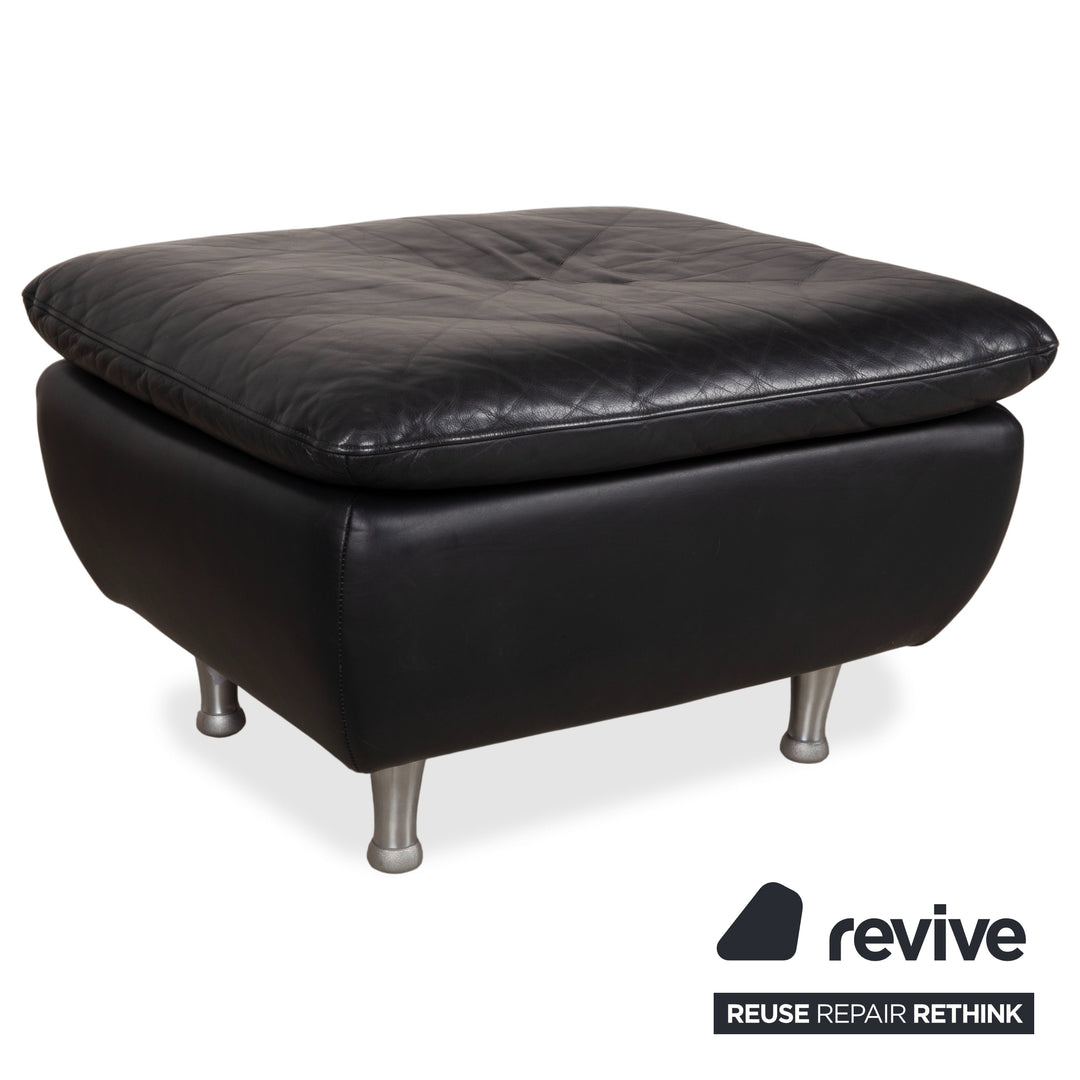 Fauteuil en cuir noir Rolf Benz 5600 avec pouf