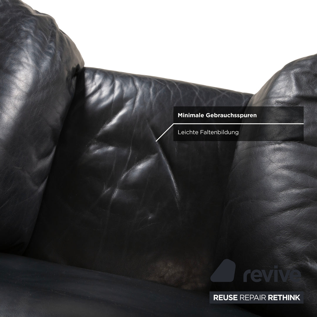 Fauteuil en cuir noir Rolf Benz 5600 avec pouf