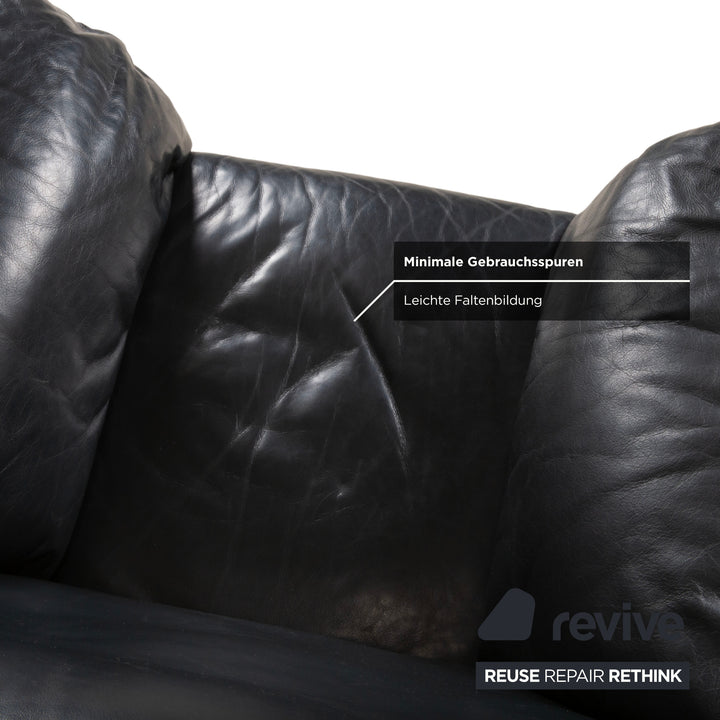 Fauteuil en cuir noir Rolf Benz 5600 avec pouf