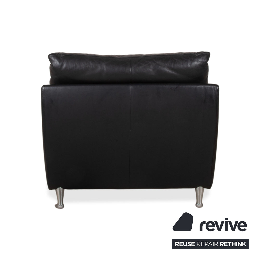 Fauteuil en cuir noir Rolf Benz 5600 avec pouf
