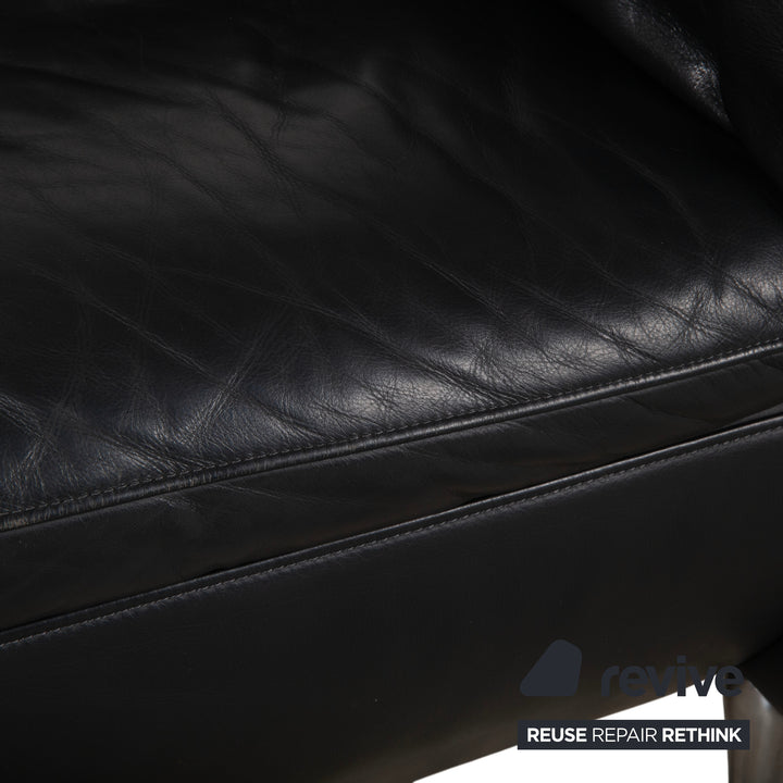 Fauteuil en cuir noir Rolf Benz 5600 avec pouf