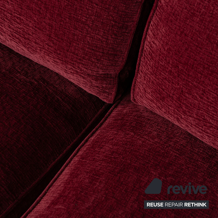 Fabric three-seater sofa red couch