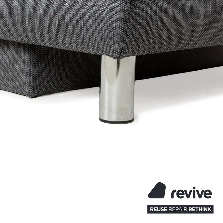 Canapé-lit en tissu gris avec fonction couchage manuelle