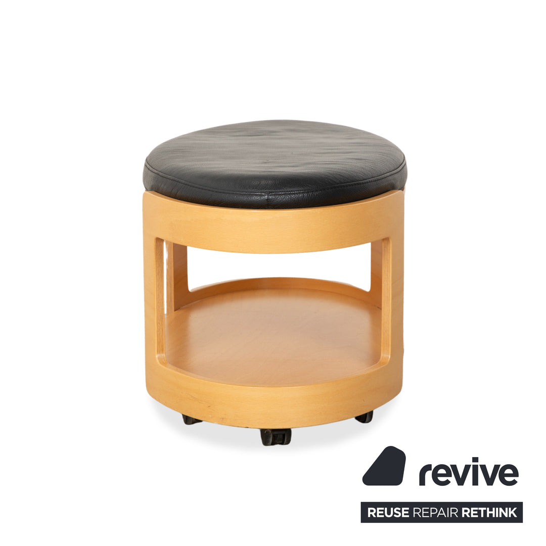 Tabouret de bar/table basse Stressless Arion en bois et cuir noir avec roulettes