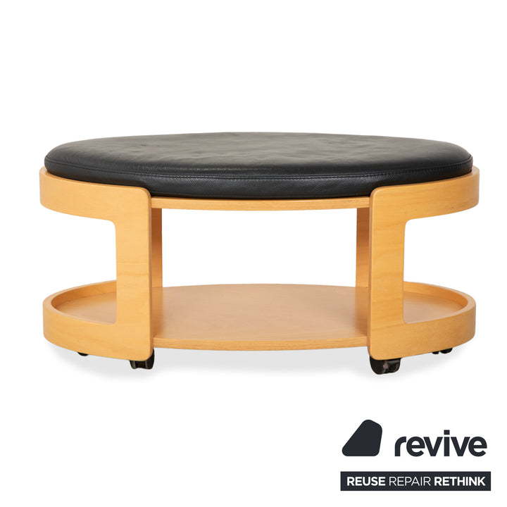 Tabouret de bar/table basse Stressless Arion en bois et cuir noir avec roulettes