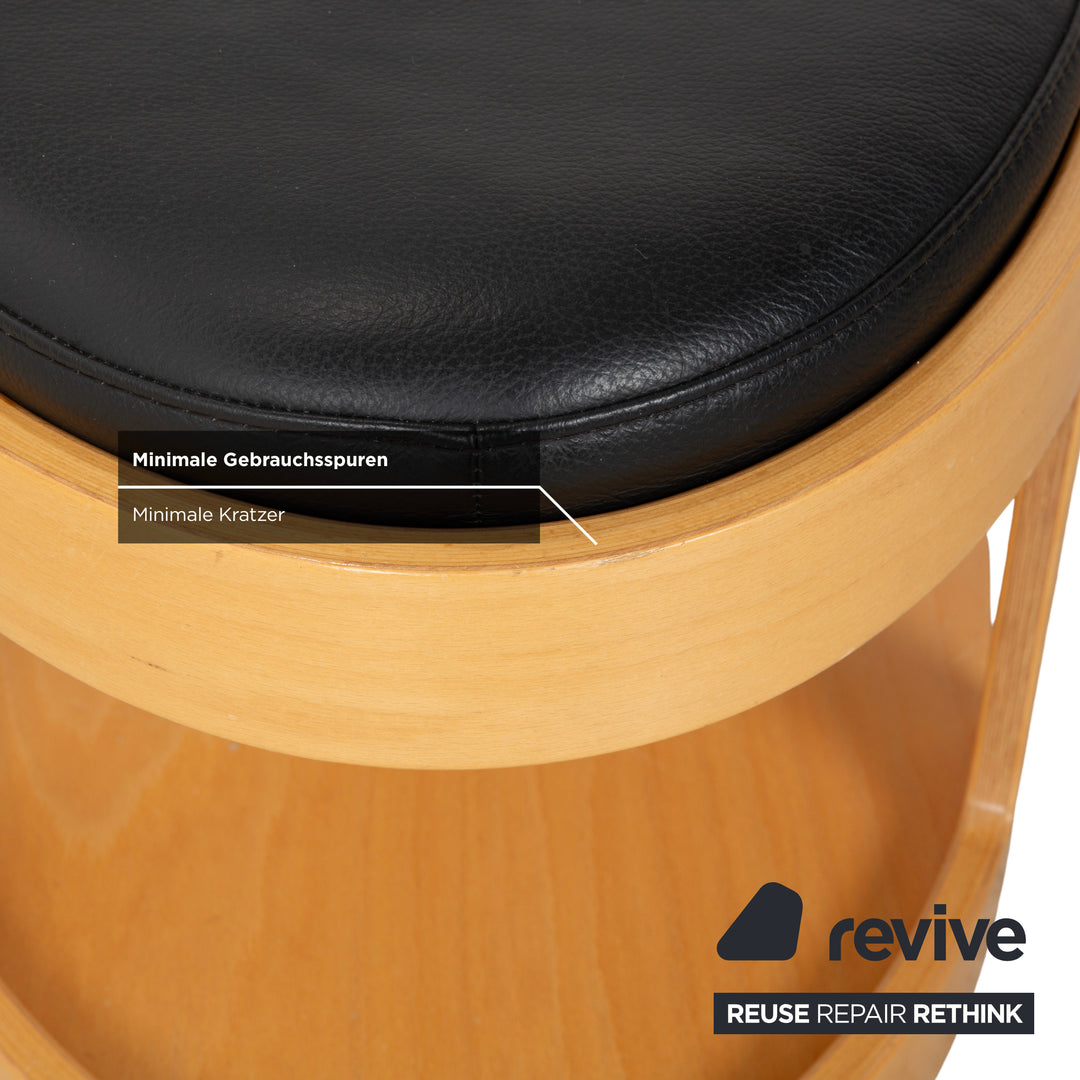 Tabouret de bar/table basse Stressless Arion en bois et cuir noir avec roulettes