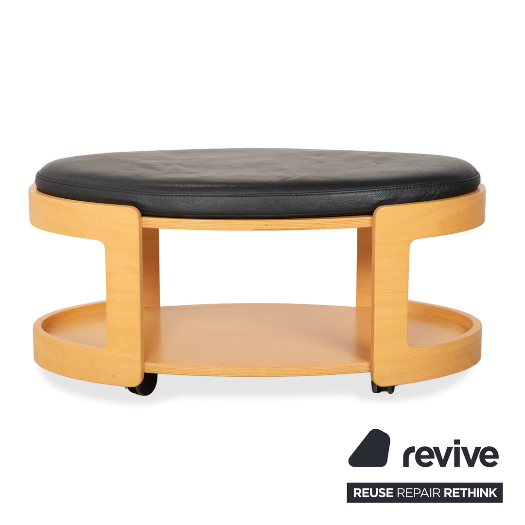 Tabouret de bar/table basse Stressless Arion en bois et cuir noir avec roulettes