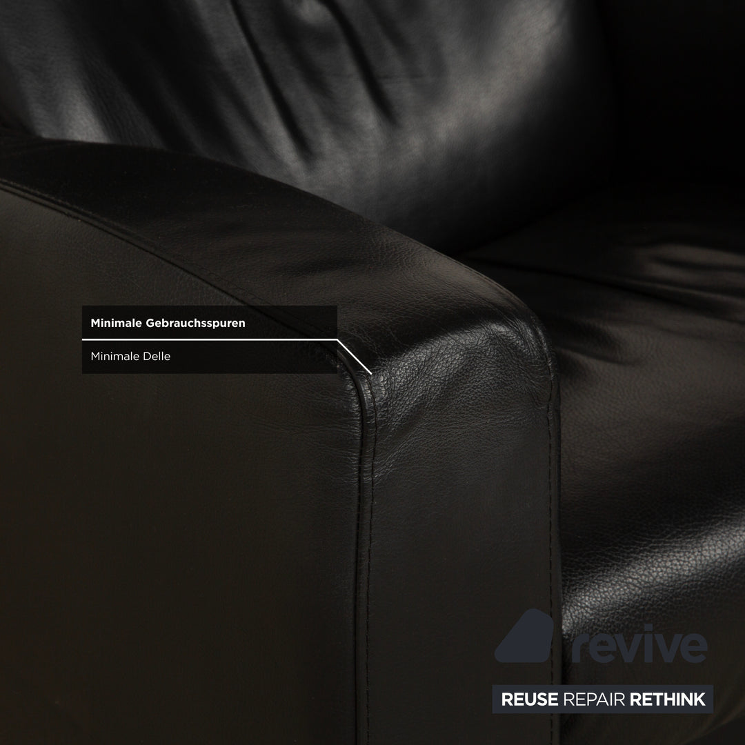 Fauteuil et repose-pieds en cuir noir Stressless Arion (x2) à commande manuelle