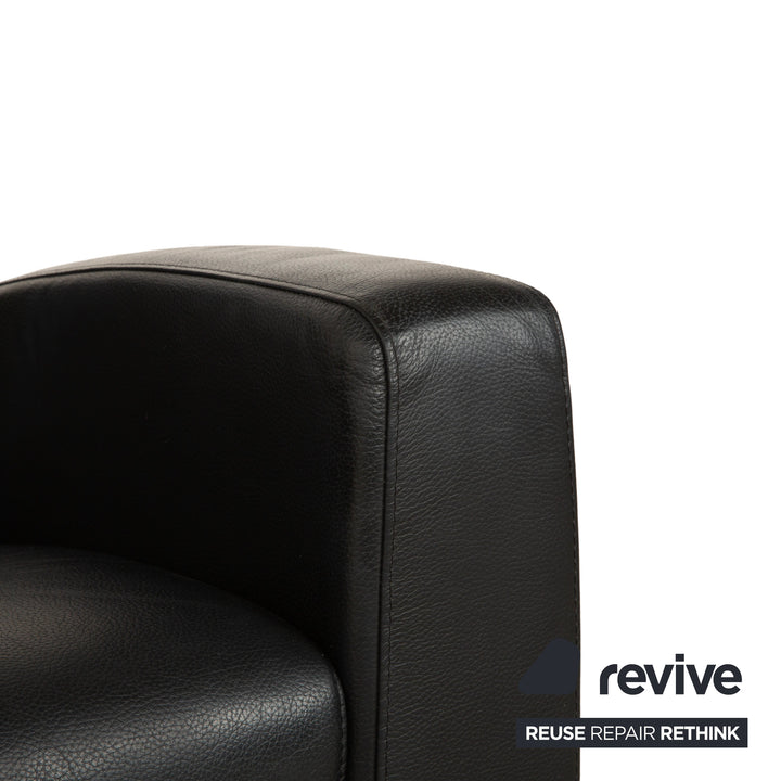 Table basse ottomane deux places Stressless Arion en cuir noir avec roulettes et fonction manuelle