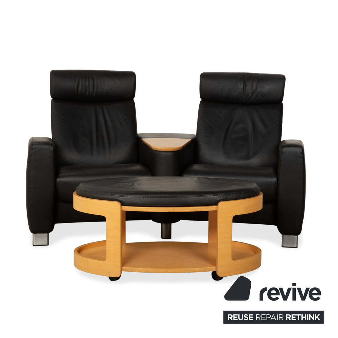Table basse ottomane deux places Stressless Arion en cuir noir avec roulettes et fonction manuelle