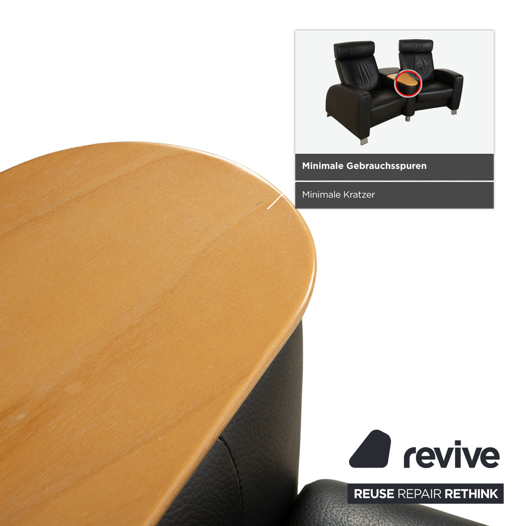 Table basse ottomane deux places Stressless Arion en cuir noir avec roulettes et fonction manuelle