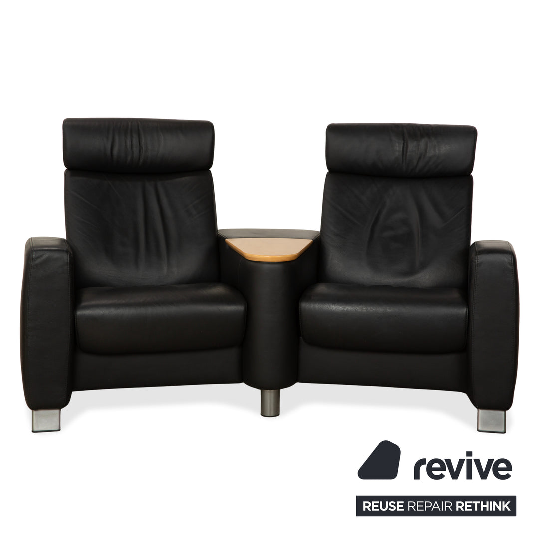 Table basse ottomane deux places Stressless Arion en cuir noir avec roulettes et fonction manuelle