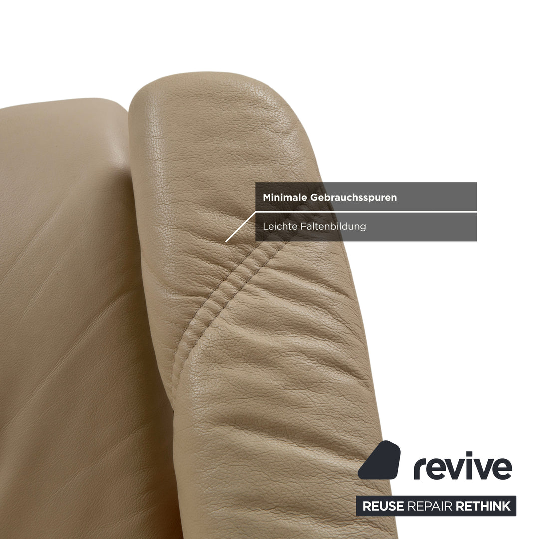Fauteuil Stressless Consul en cuir crème beige avec pouf fonction manuelle relaxation