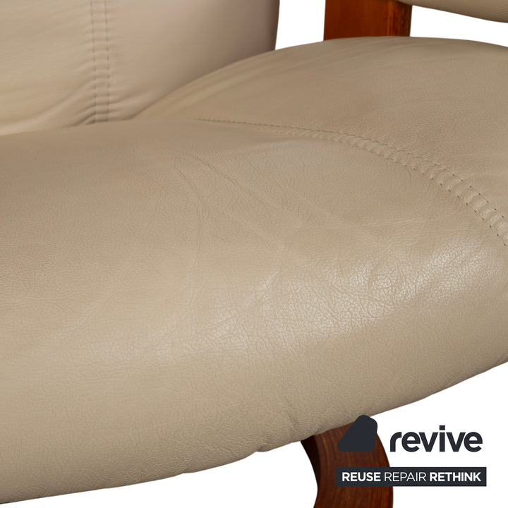 Fauteuil Stressless Consul en cuir crème beige avec pouf fonction manuelle relaxation