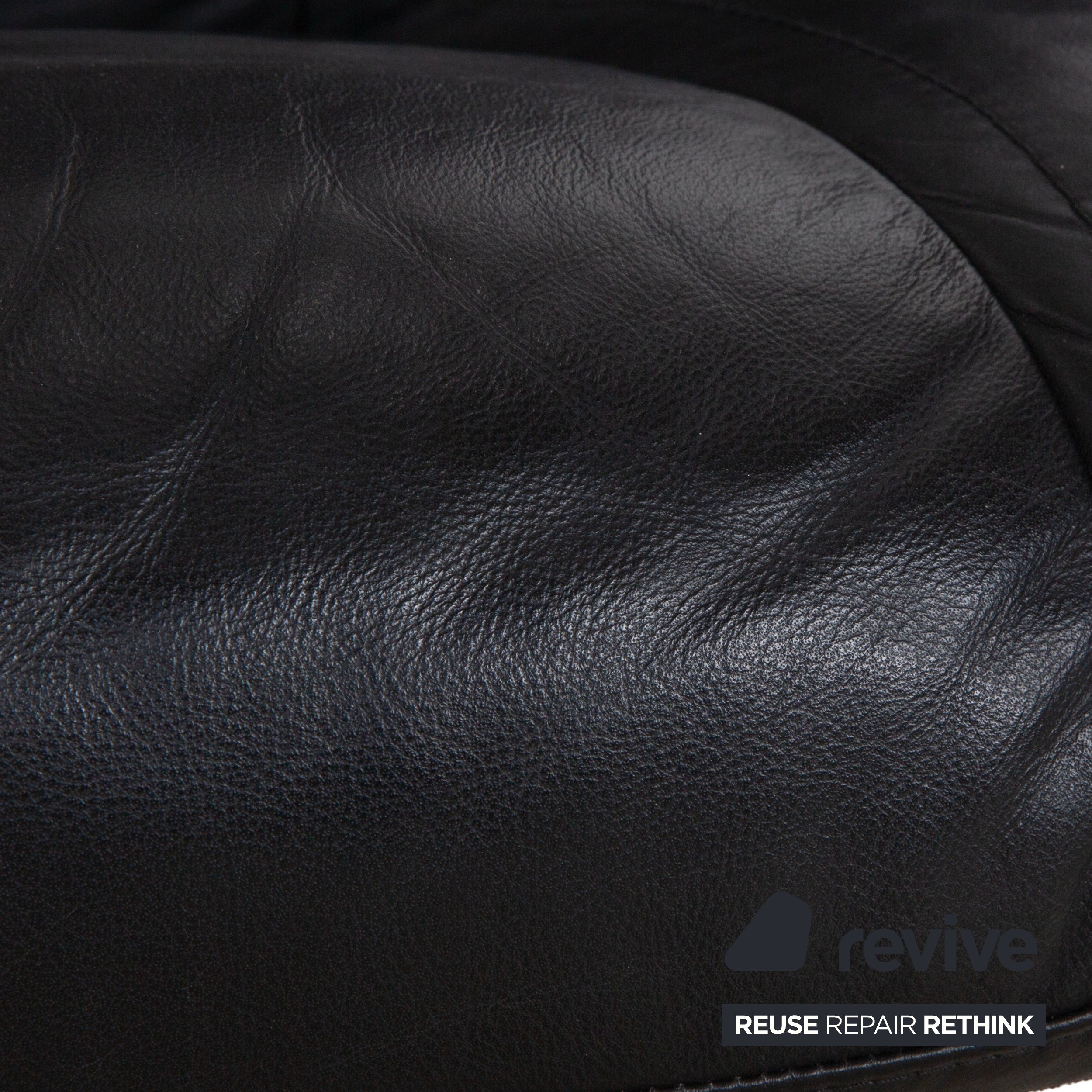 Fauteuil en cuir Stressless Wing noir avec fonction manuelle du tabouret